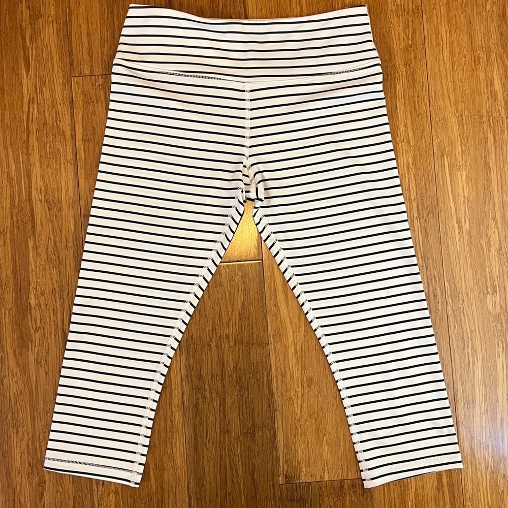 Scorpio Sol cropped leggings, size small, white with thin black stripes